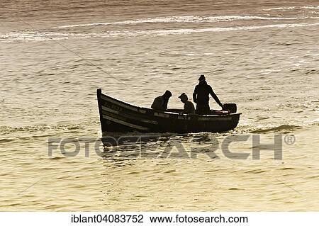 "Silhouettes of three fishermen in a small boat, entrance to the port, Essaouira, Marrakech-Tensift-El Haouz Region, Morocco, Africa" View Large Photo Image Stock Image - "Silhouettes of three fishermen in a small boat, entrance to the port, Essaouira, Marrakech-Tensift-El Haouz Region, Morocco, Africa". Fotosearch