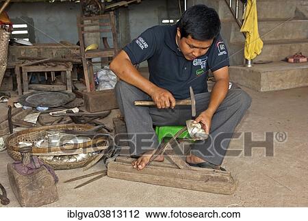 Stock Image - "Silversmith creating jewellery, Kandal Province, Cambodia, Asia". Fotosearch
