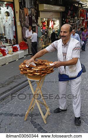 "Simit seller, bazaar district, Eminonu, Istanbul, European side, Istanbul Province, Turkey, European side, Europe" View Large Photo Image Picture - "Simit seller, bazaar district, Eminonu, Istanbul, European side, Istanbul Province, Turkey, European side, Europe". Fotosearch