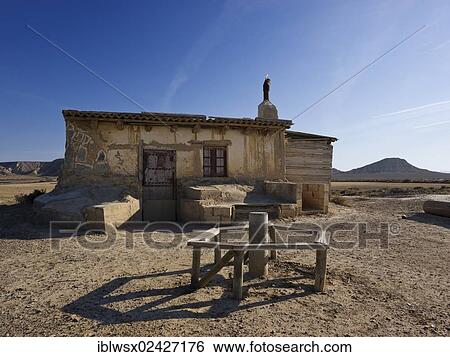 Stock Photograph - "Simple shepherds' hut, characteristic bizarre landscape of ocher clay, semidesert Bardenas Reales, UNESCO Biosphere Reserve, Navarra, northern Spain, Spain, Europe, PublicGround, Europe". Fotosearch