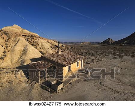 "Simple shepherds' hut, characteristic bizarre landscape of ocher clay, semidesert Bardenas Reales, UNESCO Biosphere Reserve, Navarra, northern Spain, Spain, Europe, PublicGround, Europe" View Large Photo Image Stock Photography - "Simple shepherds' hut, characteristic bizarre landscape of ocher clay, semidesert Bardenas Reales, UNESCO Biosphere Reserve, Navarra, northern Spain, Spain, Europe, PublicGround, Europe". Fotosearch