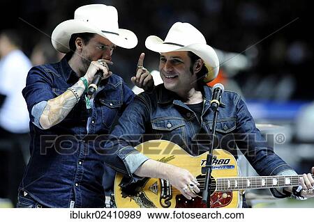 "Singer Boss Burns alias Alec Voelkel, left, and guitarist Hoss Power aka Sascha Vollmer of the The BossHoss band, performing at the qualifying match for the FIFA World Cup 2014, Germany - Sweden 4: 4, Olympic Stadium, Berlin, Germany, Europe" View Large Photo Image Stock Photo - "Singer Boss Burns alias Alec Voelkel, left, and guitarist Hoss Power aka Sascha Vollmer of the The BossHoss band, performing at the qualifying match for the FIFA World Cup 2014, Germany - Sweden 4: 4, Olympic Stadium, Berlin, Germany, Europe". Fotosearch