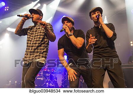 "Singers of the German band """"Sohne Mannheims"""", Tino Oac, Henning Wehland and Michael Klimas, from left, performing live at the Blue Balls Festival, Lucerne, Switzerland, Europe" View Large Photo Image Picture - "Singers of the German band """"Sohne Mannheims"""", Tino Oac, Henning Wehland and Michael Klimas, from left, performing live at the Blue Balls Festival, Lucerne, Switzerland, Europe". Fotosearch