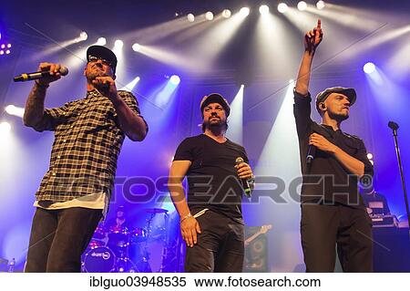 "Singers of the German band """"Sohne Mannheims"""", Tino Oac, Henning Wehland and Michael Klimas, from left, performing live at the Blue Balls Festival, Lucerne, Switzerland, Europe" View Large Photo Image Stock Photography - "Singers of the German band """"Sohne Mannheims"""", Tino Oac, Henning Wehland and Michael Klimas, from left, performing live at the Blue Balls Festival, Lucerne, Switzerland, Europe". Fotosearch