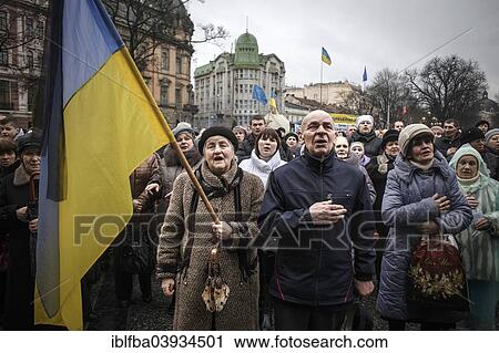 Stock Image - "Singing the national anthem, mourning ceremony for victims of the Euromaidan in Kiev, Lviv, Western Ukraine, Ukraine, Europe". Fotosearch