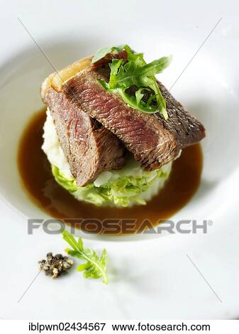 Stock Photo - Sirloin steak and salad. Fotosearch