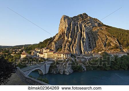 Stock Photo - "Sisteron on the Durance river, Rocher de la Baume opposite the old town, Provence region, Departement Alpes-de-Haute-Provence, France, Europe". Fotosearch