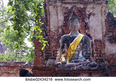 "Sitting Buddha in the ruins of Wat Phra Mahathat, Ayutthaya, Thailand, Asia" View Large Photo Image Stock Photograph - "Sitting Buddha in the ruins of Wat Phra Mahathat, Ayutthaya, Thailand, Asia". Fotosearch