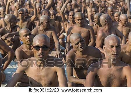 "Sitting in silence as part of the initiation of new sadhus, during Kumbha Mela festival, Allahabad, Uttar Pradesh, India, Asia" View Large Photo Image Stock Image - "Sitting in silence as part of the initiation of new sadhus, during Kumbha Mela festival, Allahabad, Uttar Pradesh, India, Asia". Fotosearch