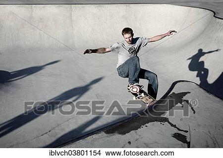 Picture - "Skateboarder skating in a skate pool, Worgl, North Tyrol, Austria, Europe". Fotosearch