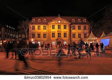 "Skating rink with skaters on the market square at night, the Palais Stutterheim behind, Erlangen, Middle Franconia, Bavaria, Germany, Europe" View Large Photo Image Picture - "Skating rink with skaters on the market square at night, the Palais Stutterheim behind, Erlangen, Middle Franconia, Bavaria, Germany, Europe". Fotosearch