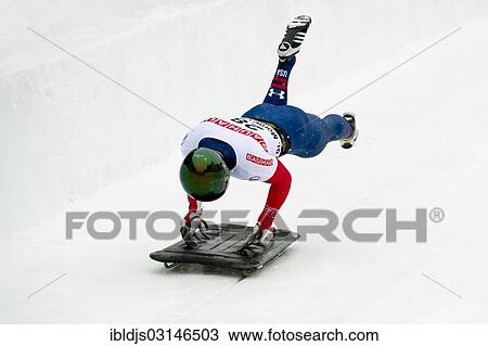 Stock Image - "Skeleton racer on the ice track, Skeleton World Cup 2013, St Moritz, Engadin, Grisons, Switzerland, Europe". Fotosearch