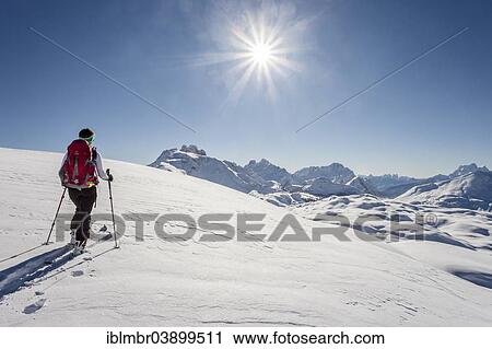 "Ski tourer climbing Seekofel mountain, Fanes-Sennes-Prags Nature Park, Kleine Gaisl mountain, Hohe Gaisl mountain and Cristallo mountain at the back, St. Vigil, Puster Valley, Dolomite Alps, Province of South Tyrol, Italy, Europe" View Large Photo Image Stock Image - "Ski tourer climbing Seekofel mountain, Fanes-Sennes-Prags Nature Park, Kleine Gaisl mountain, Hohe Gaisl mountain and Cristallo mountain at the back, St. Vigil, Puster Valley, Dolomite Alps, Province of South Tyrol, Italy, Europe". Fotosearch