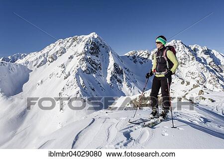 "Ski tourer on the summit of Mt Seespitz in the Deutschnonsberg area with the mountains Illmenspitz and Proves at the back, Ulten Valley, Merano and surroundings, Province of South Tyrol, Trentino-Alto Adige, Italy, Europe" View Large Photo Image Stock Image - "Ski tourer on the summit of Mt Seespitz in the Deutschnonsberg area with the mountains Illmenspitz and Proves at the back, Ulten Valley, Merano and surroundings, Province of South Tyrol, Trentino-Alto Adige, Italy, Europe". Fotosearch