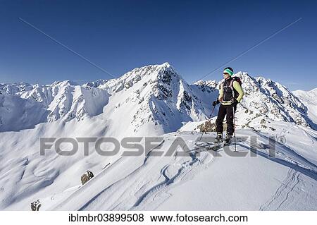 "Ski tourer standing on the summit of Seespitz mountain, Deutschnonsberg, Ilmenspitze mountain at the back, Proveis, Ulten Valley, Merano region, Province of South Tyrol, Italy, Europe" View Large Photo Image Stock Photo - "Ski tourer standing on the summit of Seespitz mountain, Deutschnonsberg, Ilmenspitze mountain at the back, Proveis, Ulten Valley, Merano region, Province of South Tyrol, Italy, Europe". Fotosearch