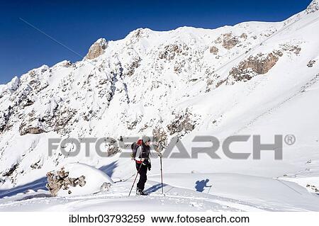 "Ski tourers ascending to the Col di Poma in Villnoss valley, behind the Odle di Eores, Dolomites, South Tyrol, Italy, Europe" View Large Photo Image Stock Photo - "Ski tourers ascending to the Col di Poma in Villnoss valley, behind the Odle di Eores, Dolomites, South Tyrol, Italy, Europe". Fotosearch