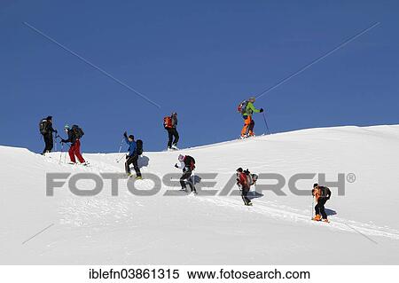 "Ski touring group in the ascent to the Piz Arina, Graubunden, Switzerland, Europe" View Large Photo Image Stock Photography - "Ski touring group in the ascent to the Piz Arina, Graubunden, Switzerland, Europe". Fotosearch