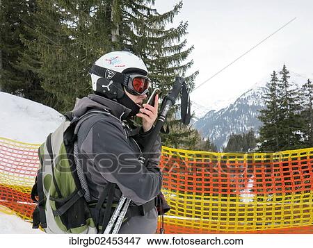 "Skier on a barrier speaks in their smartphone, St. Anton am Arlberg, Tyrol, Austria, Europe" View Large Photo Image Stock Photo - "Skier on a barrier speaks in their smartphone, St. Anton am Arlberg, Tyrol, Austria, Europe". Fotosearch