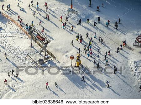 Stock Photograph - "Skiers, aerial view, Winterberg, Hochsauerland, North Rhine-Westphalia, Germany, Europe". Fotosearch