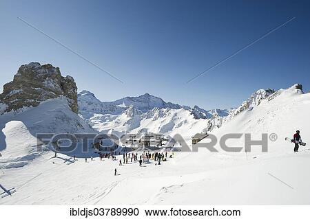 "Skiers and snow-covered mountains, Aiguille Percee, Tignes, Val-d’Isere, Savoie, Alps, France, Europe" View Large Photo Image Stock Image - "Skiers and snow-covered mountains, Aiguille Percee, Tignes, Val-d’Isere, Savoie, Alps, France, Europe". Fotosearch