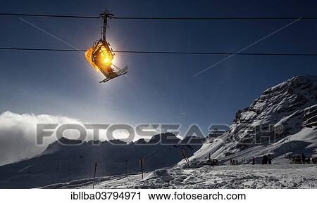 Stock Image - "Skiers in chairlift, Zugspitze, Bavaria, Germany, Europe". Fotosearch