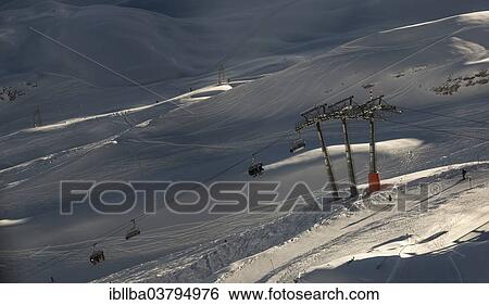 Stock Photograph - "Skiers in chairlift, Zugspitze, Bavaria, Germany, Europe". Fotosearch