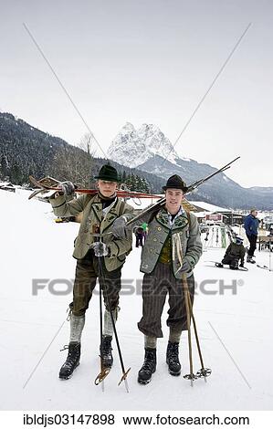 Stock Photo - "Skiers with equipment from the 1930s, Mt Alpspitze at back, Garmisch-Partenkirchen, Upper Bavaria, Bavaria, Germany, Europe". Fotosearch