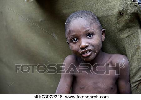 "Skinny boy, portrait, Camp Icare for earthquake refugees, Fort National, Port-au-Prince, Haiti, North America" View Large Photo Image Stock Photograph - "Skinny boy, portrait, Camp Icare for earthquake refugees, Fort National, Port-au-Prince, Haiti, North America". Fotosearch
