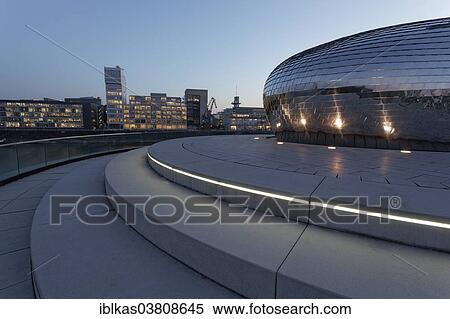 "Skyline and futuristic pavilion with a mirrored facade, Hyatt Regency hotel bar """"Pebble's"""" at the blue hour, Media Harbour, Dusseldorf, North Rhine-Westphalia, Germany, Europe" View Large Photo Image Stock Photography - "Skyline and futuristic pavilion with a mirrored facade, Hyatt Regency hotel bar """"Pebble's"""" at the blue hour, Media Harbour, Dusseldorf, North Rhine-Westphalia, Germany, Europe". Fotosearch