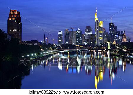Stock Photography - "Skyline at night, Lindner Main Plaza Tower, TaunusTurm, Tower 185, Commerzbank, Messeturm, ECB, European Central Bank, Helaba, Landesbank Hessen, Deutsche Bank, Frankfurt Cathedral, Flosserbrucke bridge, Frankfurt am Main, Hesse, Germany, Europe". Fotosearch