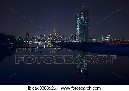 "Skyline at night with Main Plaza tower in the left foreground, Deutschherrnbrucke bridge in the centre and the new building of the European Central Bank the right, Frankfurt am Main, Hesse, Germany, Europe" View Large Photo Image Stock Photo - "Skyline at night with Main Plaza tower in the left foreground, Deutschherrnbrucke bridge in the centre and the new building of the European Central Bank the right, Frankfurt am Main, Hesse, Germany, Europe". Fotosearch