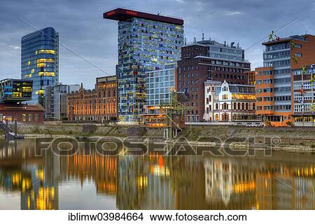 "Skyline at the Media Harbour, Colorium building with Innside Hotel, Roggendorf-Haus, dusk, blue hour, Dusseldorf, North Rhine-Westphalia, Germany, Europe" View Large Photo Image Picture - "Skyline at the Media Harbour, Colorium building with Innside Hotel, Roggendorf-Haus, dusk, blue hour, Dusseldorf, North Rhine-Westphalia, Germany, Europe". Fotosearch