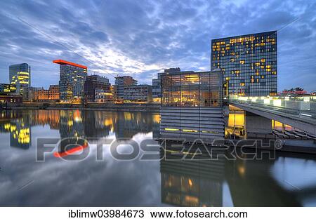 "Skyline at the Media Harbour, Lido, Colorium building with Innside Hotel, Roggendorf-Haus, Hyatt Regency Hotel, Twilight, blue hour, Dusseldorf, North Rhine-Westphalia, Germany, Europe" View Large Photo Image Stock Image - "Skyline at the Media Harbour, Lido, Colorium building with Innside Hotel, Roggendorf-Haus, Hyatt Regency Hotel, Twilight, blue hour, Dusseldorf, North Rhine-Westphalia, Germany, Europe". Fotosearch