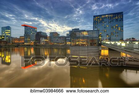 "Skyline at the Media Harbour, Lido, Colorium building with Innside Hotel, Roggendorf-Haus, Hyatt Regency Hotel, dusk, blue hour, Dusseldorf, North Rhine-Westphalia, Germany, Europe" View Large Photo Image Stock Photograph - "Skyline at the Media Harbour, Lido, Colorium building with Innside Hotel, Roggendorf-Haus, Hyatt Regency Hotel, dusk, blue hour, Dusseldorf, North Rhine-Westphalia, Germany, Europe". Fotosearch