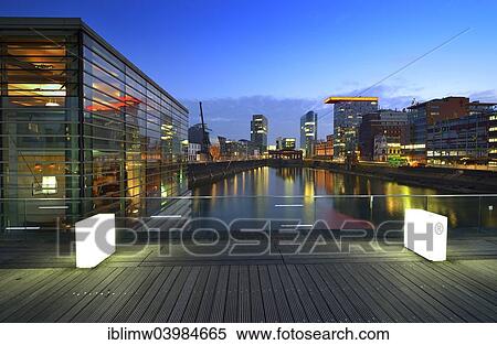 "Skyline at the Media Harbour, Lido, Colorium building with Innside Hotel, Roggendorf-Haus, dusk, blue hour, Dusseldorf, North Rhine-Westphalia, Germany, Europe" View Large Photo Image Stock Photography - "Skyline at the Media Harbour, Lido, Colorium building with Innside Hotel, Roggendorf-Haus, dusk, blue hour, Dusseldorf, North Rhine-Westphalia, Germany, Europe". Fotosearch