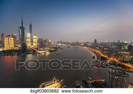 "Skyline Financial District with Oriental Pearl Tower, Shanghai Tower, Pudong and Bund promenade with Huangpu River at dusk, Shanghai, China, Asia" View Large Photo Image Stock Image - "Skyline Financial District with Oriental Pearl Tower, Shanghai Tower, Pudong and Bund promenade with Huangpu River at dusk, Shanghai, China, Asia". Fotosearch