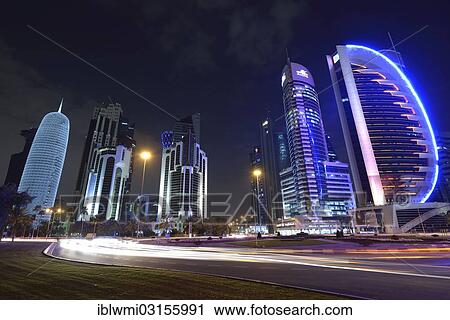 "Skyline of Doha at night with Palm Tower 1 and 2, the World Trade Center, Tornado Tower, Burj Qatar Tower with silver illumination, Kahra Maa Tower and the Doha Bank Tower, Doha, Doha, Qatar, Asia" View Large Photo Image Stock Image - "Skyline of Doha at night with Palm Tower 1 and 2, the World Trade Center, Tornado Tower, Burj Qatar Tower with silver illumination, Kahra Maa Tower and the Doha Bank Tower, Doha, Doha, Qatar, Asia". Fotosearch