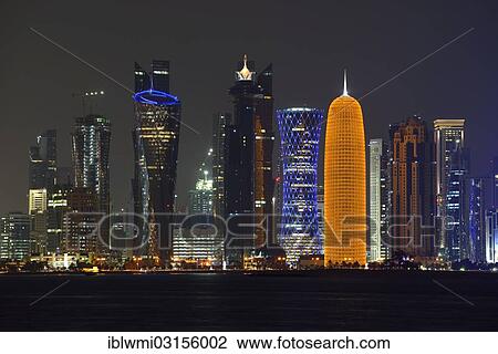 "Skyline of Doha at night with the Al Bidda Tower, Palm Tower 1 and 2, the World Trade Center, Tornado Tower and the Burj Qatar Tower with golden illuminations, Doha, Doha, Qatar, Asia" View Large Photo Image Stock Image - "Skyline of Doha at night with the Al Bidda Tower, Palm Tower 1 and 2, the World Trade Center, Tornado Tower and the Burj Qatar Tower with golden illuminations, Doha, Doha, Qatar, Asia". Fotosearch