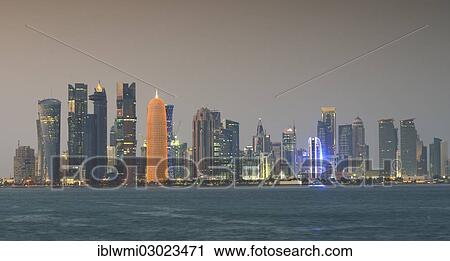 "Skyline of Doha with Al Bidda Tower, Palm Tower 1 and 2, World Trade Center, Tornado Tower, Burj Qatar Tower with golden illumination, Al Fardan Residences Tower, Doha Bank Tower, at dusk, Doha Corniche, Doha, Doha, Qatar, Asia" View Large Photo Image Stock Image - "Skyline of Doha with Al Bidda Tower, Palm Tower 1 and 2, World Trade Center, Tornado Tower, Burj Qatar Tower with golden illumination, Al Fardan Residences Tower, Doha Bank Tower, at dusk, Doha Corniche, Doha, Doha, Qatar, Asia". Fotosearch