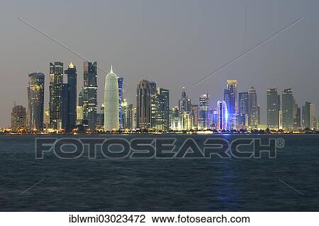 "Skyline of Doha with Al Bidda Tower, Palm Tower 1 and 2, World Trade Center, Tornado Tower, Burj Qatar Tower with silver illumination, Al Fardan Residences Tower, Doha Bank Tower, at dusk, Doha Corniche, Doha, Doha, Qatar, Asia" View Large Photo Image Stock Image - "Skyline of Doha with Al Bidda Tower, Palm Tower 1 and 2, World Trade Center, Tornado Tower, Burj Qatar Tower with silver illumination, Al Fardan Residences Tower, Doha Bank Tower, at dusk, Doha Corniche, Doha, Doha, Qatar, Asia". Fotosearch