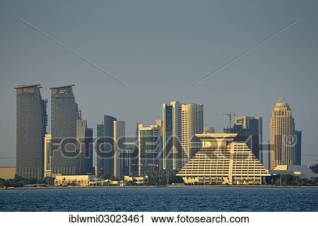 "Skyline of Doha with Al Fardan Residences Tower, Doha Bank Tower, Sheraton Doha Hotel, Four Seasons Hotel, in the evening light, Doha Corniche, Doha, Doha, Qatar, Asia" View Large Photo Image Stock Image - "Skyline of Doha with Al Fardan Residences Tower, Doha Bank Tower, Sheraton Doha Hotel, Four Seasons Hotel, in the evening light, Doha Corniche, Doha, Doha, Qatar, Asia". Fotosearch