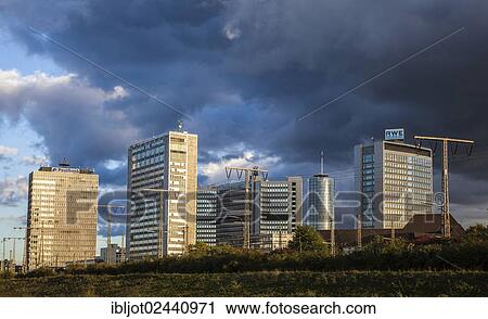 Stock Image - "Skyline of downtown Essen with various administrative offices and headquarters of large companies such as RWE and Evonik, Essen, North Rhine-Westphalia, Germany, Europe". Fotosearch