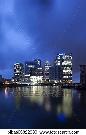 Stock Image - "Skyline of the financial district Canary Wharf with the Blackwall Basin at the front at dusk, Docklands, London, England, United Kingdom, Europe". Fotosearch