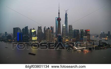 "Skyline of the Financial District with the Oriental Pearl Tower and the Shanghai Tower, Pudong with the Huangpu River at dusk, Shanghai, China, Asia" View Large Photo Image Picture - "Skyline of the Financial District with the Oriental Pearl Tower and the Shanghai Tower, Pudong with the Huangpu River at dusk, Shanghai, China, Asia". Fotosearch