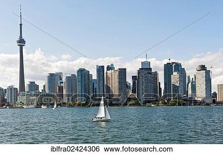 Skyline of Toronto seen from the ferry from Toronto to Centre Island, CN Tower, Lake Ontario, Toronto, province of Ontario, Canada, North America View Large Photo Image Stock Photograph - Skyline of Toronto seen from the ferry from Toronto to Centre Island, CN Tower, Lake Ontario, Toronto, province of Ontario, Canada, North America. Fotosearch