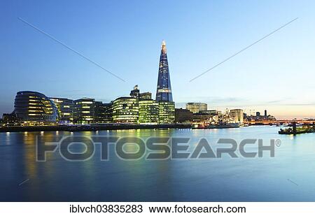 Stock Image - "Skyline with City Hall and The Shard with Themse at dusk, London, England, United Kingdom, Europe". Fotosearch