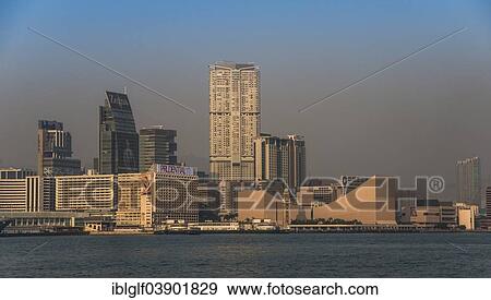 Stock Photo - "Skyline with pier, the Clock Tower and the Cultural Centre at the Tsim Sha Tsui Promenade, Kowloon, Hong Kong, China, Asia". Fotosearch