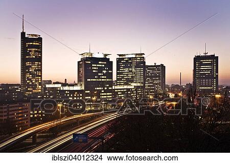 Picture - "Skyline with the A40 motorway, the RWE Tower, the high-rise buildings of Evonik and Postbank, Essen, Ruhr district, North Rhine-Westphalia, Germany, Europe". Fotosearch