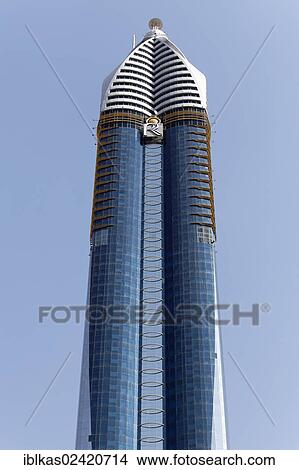 Skyscraper with a glass facade, Rose Rayhaan Hotel, Sheikh Zayed Road, Dubai, United Arab Emirates, Middle East, Asia View Large Photo Image Picture - Skyscraper with a glass facade, Rose Rayhaan Hotel, Sheikh Zayed Road, Dubai, United Arab Emirates, Middle East, Asia. Fotosearch