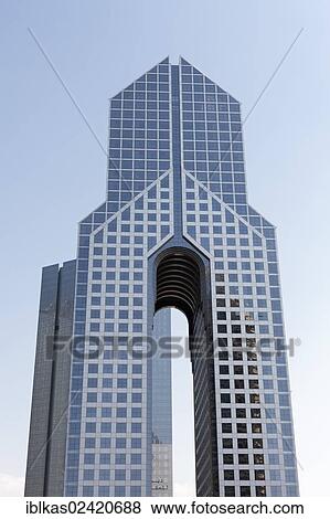 Skyscraper with an opening, Sheikh Zayed Road, Dubai, United Arab Emirates, Middle East, Asia View Large Photo Image Stock Photo - Skyscraper with an opening, Sheikh Zayed Road, Dubai, United Arab Emirates, Middle East, Asia. Fotosearch